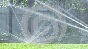 Grass irrigation. Garden Irrigation sprinkler watering lawn.