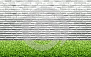 Grass lawn and white brick wall.