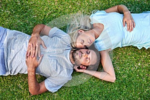 Grass laying sleeping couple