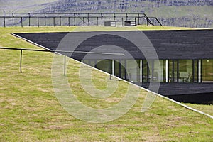 Grass roof geometric building in Eysturoy. Nordragota village, Faroe photo