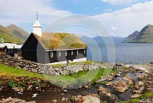 Grass roofed Church in the village of Funningur on the island of Eysturoy, Faroe Islands, Denmark photo