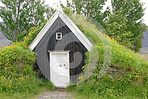 Grass roofed house in Iceland used as shelter for travellers photo