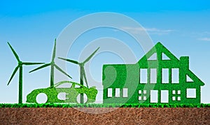 Grass in shape of wind turbines, electric car and building