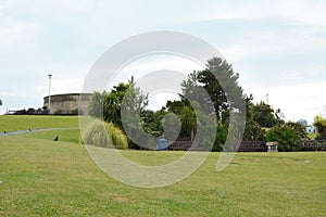 Grass slope with seating in front of historic Redoubt fortress in Eastbourne