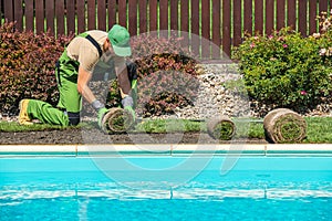 Grass Turfs Installation Along Side of Swimming Pool