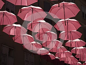 Grasse France pink umbrellas street