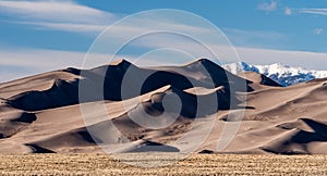 Grasslands, Dune Field and High Mountain Peaks are part of The Great Sand Dunes National Park, Colorado.