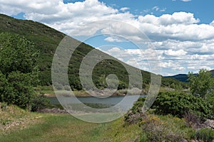 Grassy hill overlooking Vega Reservoir in Western Colorado