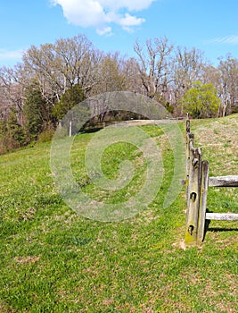 Grassy Hill and Rough Hewn Wood Fence