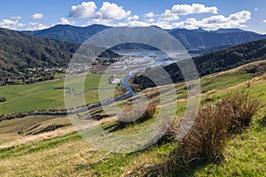 Grassy hills above Havelock town and Pelorus Sound in Marlborough, New Zealand