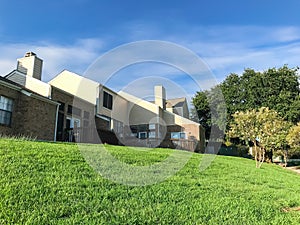 Grassy lawn backyard of townhouse complex in suburban DFW, Texas