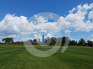Grassy lawn with distant view of the Freedom Tower (1 World Trade)