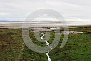 Grassy Mudbanks on Seafront at Grange-over-Sands, Cumbria, England, UK