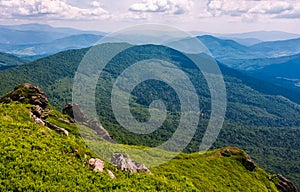 Grassy slope with huge boulders