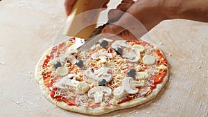 Grate cheese over tasty pizza