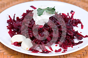 Grated beets with garlic in a plate