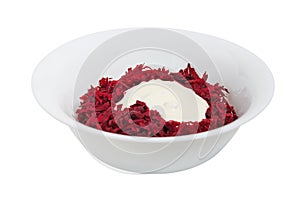 Grated beets with sour cream in a dish