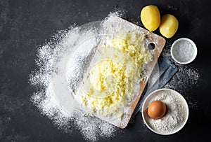 Grated boiled potatoes with flour, egg and salt for the preparation of an Italian dish - potato gnocchi