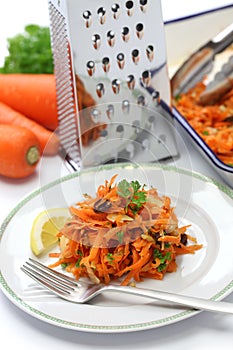 Grated carrot salad and grater