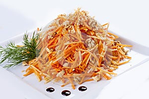 Grated carrots with walnuts.