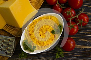 Grated cheese, cherry tomatoes   food health  on a wooden background organicvegetable