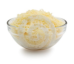 Grated cheese in a glass bowl isolated