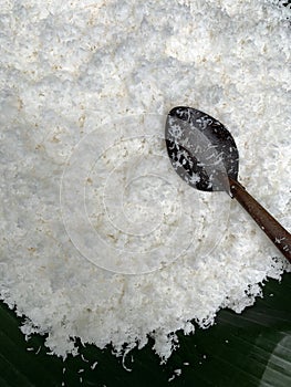 Grated coconut meat on banana leaf for making sweetmeat