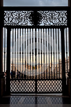 Grated door on St Peters Basilica view to square at Vatican photo