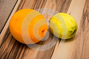 Grated lemon and orange placed on the wooden table