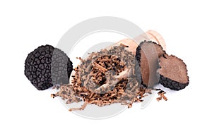 Grated Truffle on a wooden spoon. Fresh black truffles isolated on a white background. Delicacy exclusive truffle