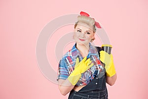 Gratefulness housewife holding craft cup. Portrait of thankfulness woman in latex gloves with cup of coffee in pin-up style.