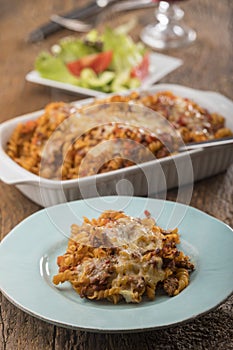 Gratinated pasta on wood