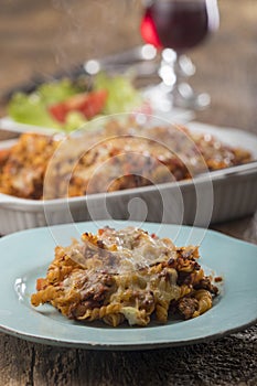 Gratinated pasta on wood