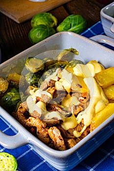 Gratinated Zurich ragout with Brussels sprouts, potatoes and Bearnaise sauce