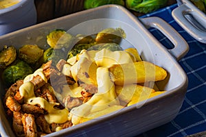 Gratinated Zurich ragout with Brussels sprouts, potatoes and Bearnaise sauce