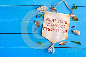 Gratitude changes everything text on Paper Scroll