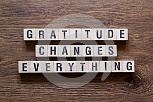 Gratitude changes everything - word concept on building blocks, text