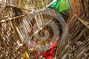 Grave of bamboo sticks in cemetery in Terunyan village. Traditional Kuburan in Bali, Indonesia. Bodies are buried above ground.