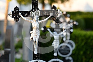 Grave crosses in a row in the cemetery Wels in the evening sun, Austria, Europe