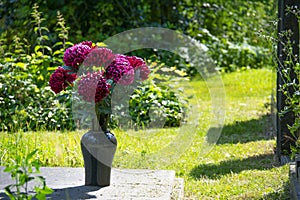 Grave with fresh red flowers in Weissensee Jewish cemetery Berlin Germany