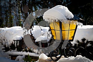 Grave light, grave lamp, lantern covered with snow