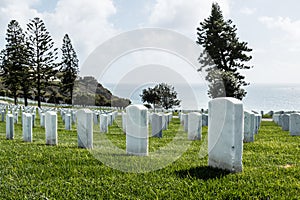 Grave Markers with an Ocean Background at Fort Rosecrans National Cemetery photo