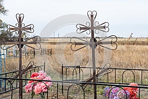 Grave with old metal crosses