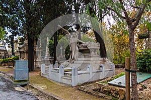 Grave with sculpture of angel on Montjuic Cemetery, Barcelona, Spain