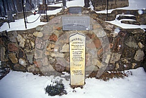 Grave site of Wild Bill Hickock, infamous outlaw in Mount Moriah Cemetery, Deadwood, SD in winter snow