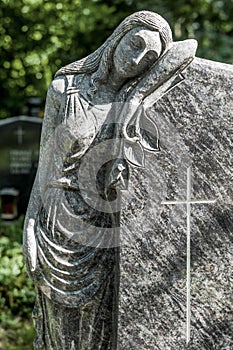 Grave stone with figure