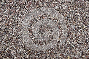 Gravel in beige rown and grey tones - background texture