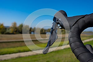 Gravel bike gear and breake levers against a blue sky background. Adventure on a gravelike bike.