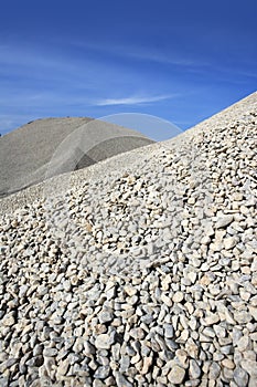 Gravel gray mound quarry stock blue sky