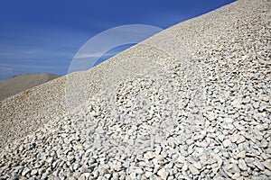 Gravel gray mound quarry stock blue sky